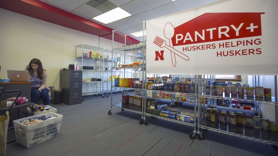 Female students works at the Helping Huskers Pantry