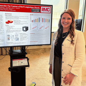 Kyra Elliot with scientific poster