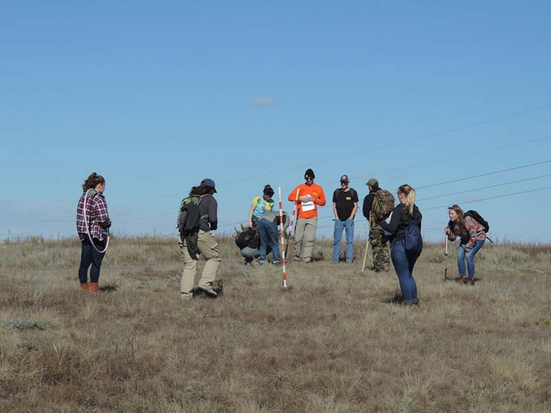 students marking a field