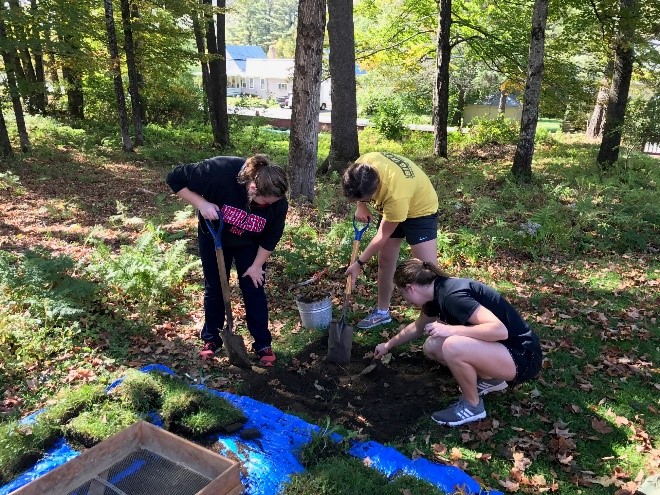 Morrill Scholars working on excavating the grounds at the Morrill Homestead in Stafford, VT as part of their service project.