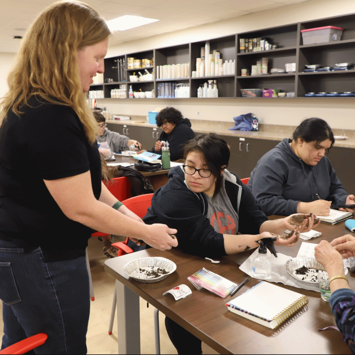 High school students, family and friends in the Indigenous Food Sovereignty Program learn about the soil in their gardens in a class taught by Becky Young, an assistant professor of practice in Agronomy and Horticulture.