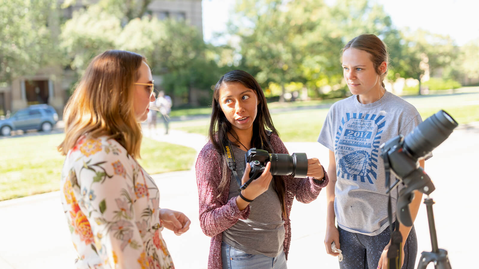 Students taking photos outside