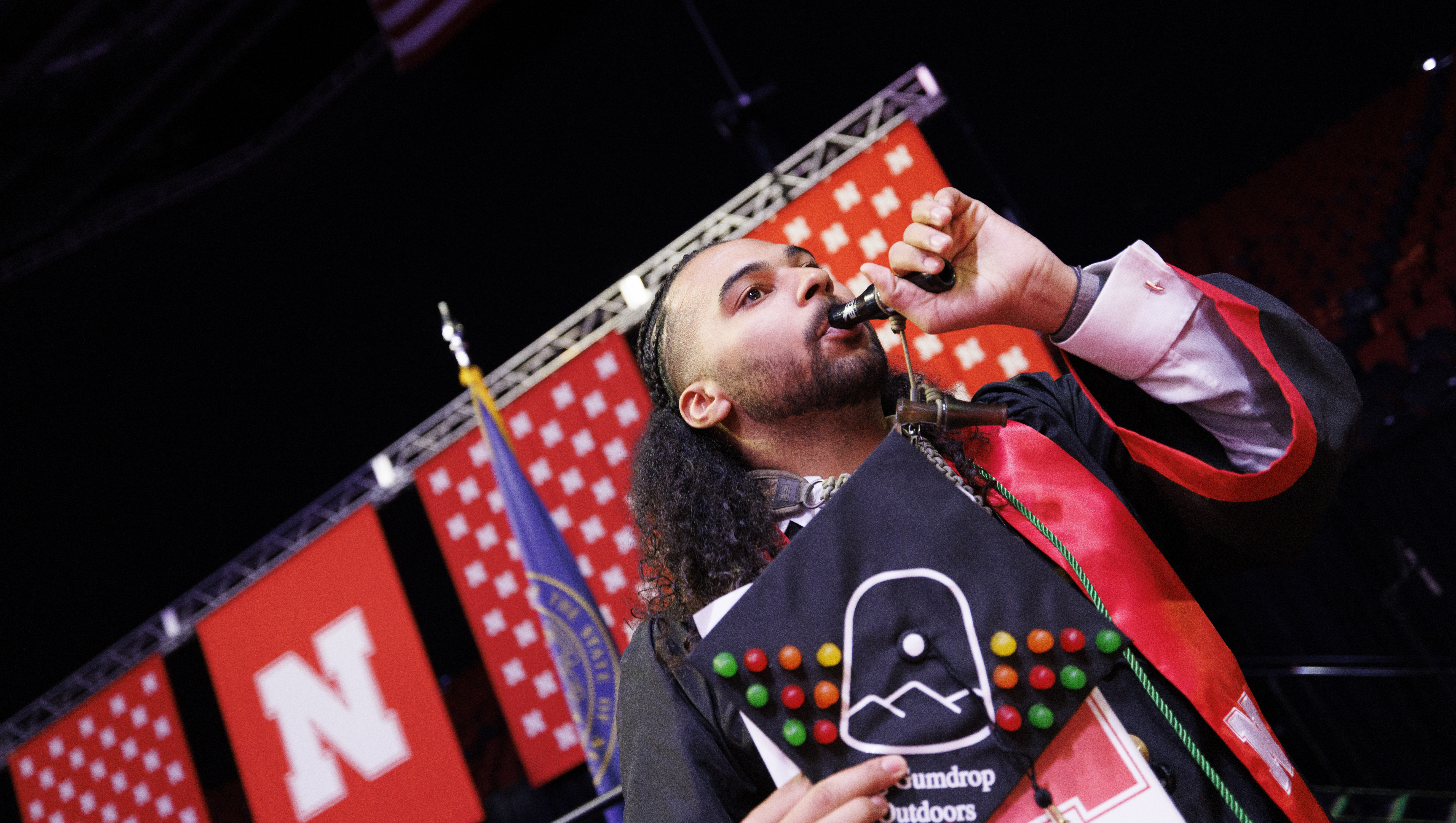 Elijah Riley blowing duck call at UNL commencement