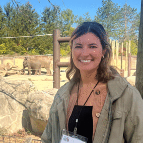Katie Campbell in front of elephant enclosure