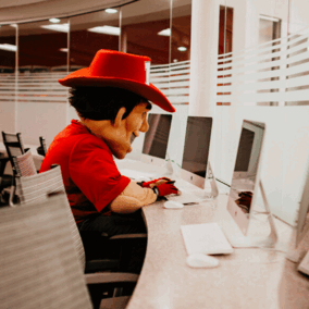 Herbie Husker sitting at computer