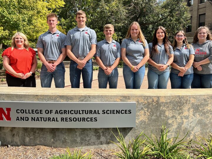 Members of the CASNR Career Center team pose in front of a CASNR sign on East Campus