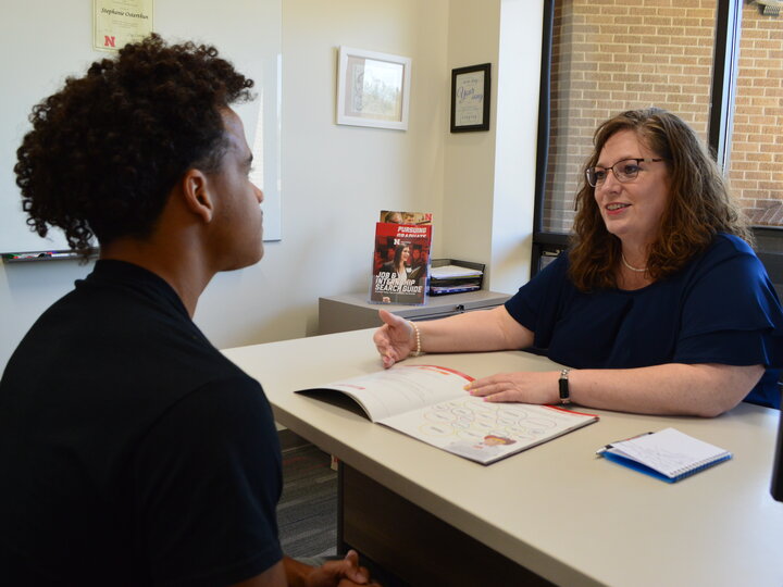 student meeting with a career coach in her office