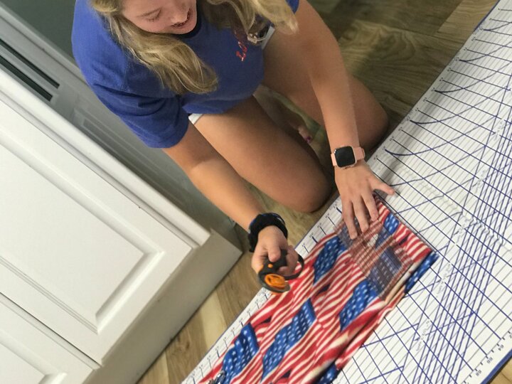 Engler Agribusiness Entrepreneurship student making leg wraps for show lambs