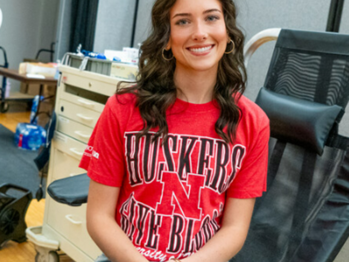 Lauren Roles poses on a chair at a campus blood drive.