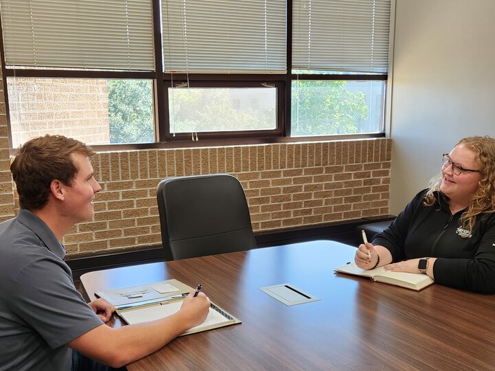 Student interviewing with an employer