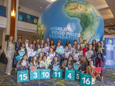 kids in front of a globe