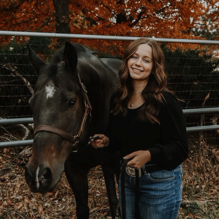 Christen Curtis next to horse