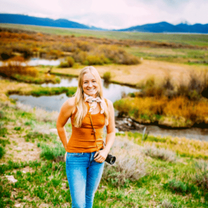 Mariah Lundgren standing in a rural landscape