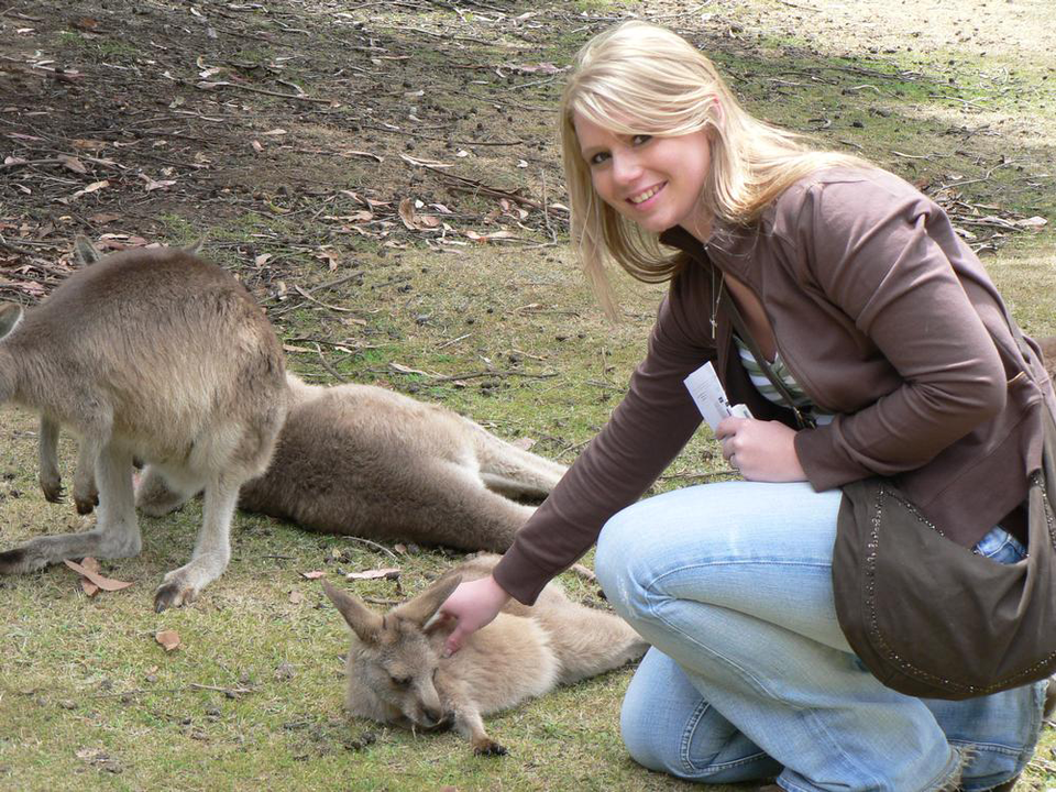 student with wallaby in Tasmania